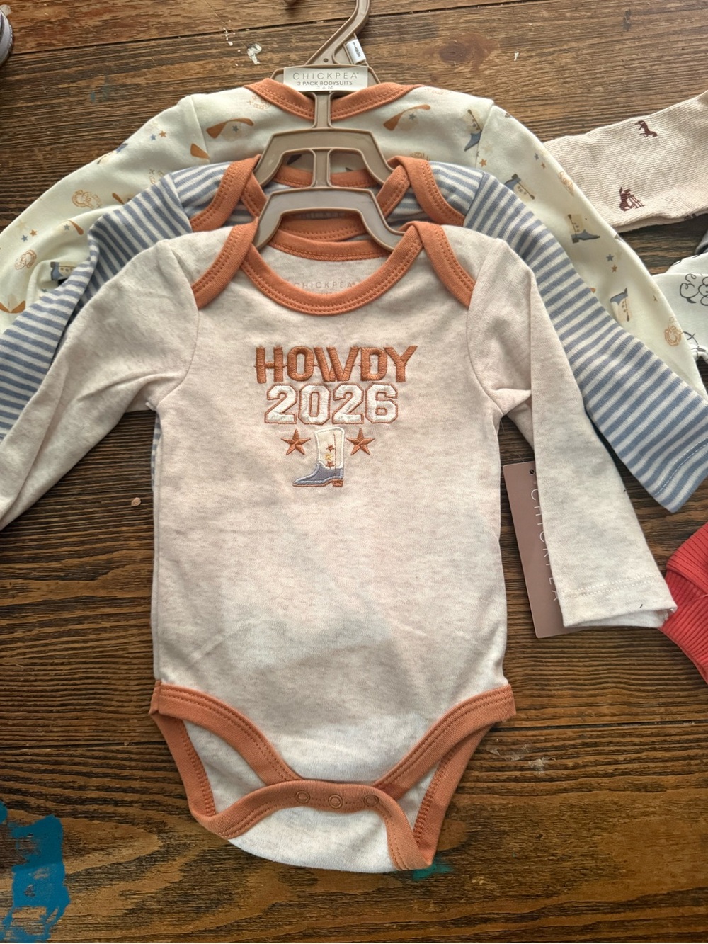 chick pea Cream and Rust "Howdy 2026" Long-Sleeve One-Piece